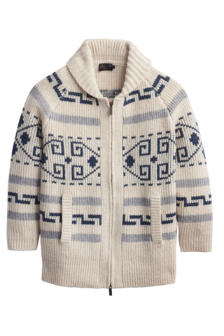 A cream-colored knit zip-up cardigan sweater with a high ribbed collar and navy blue geometric patterns, shown against a plain white background.