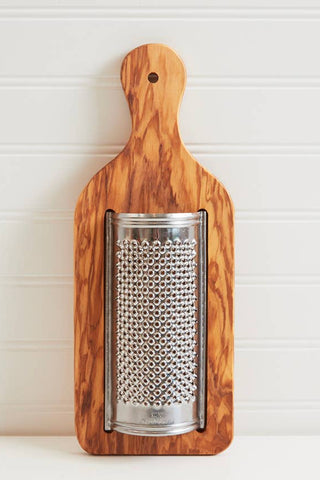 Wooden grater with metal surface on a white background