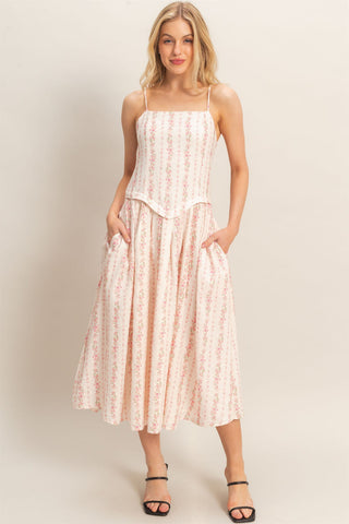Woman wearing a floral dress.