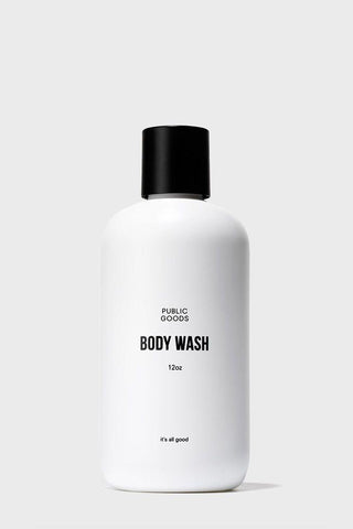 A white plastic bottle with a black cap labeled 'Public Goods BODY WASH 13oz'.